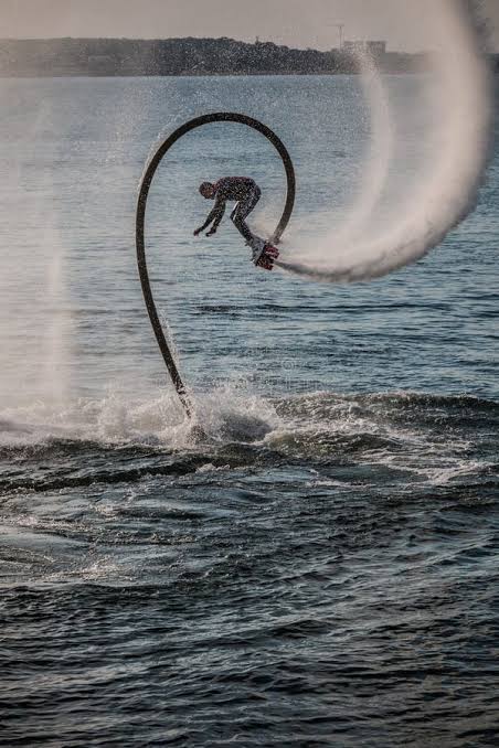 Instructor guiding a first-time fly boarder